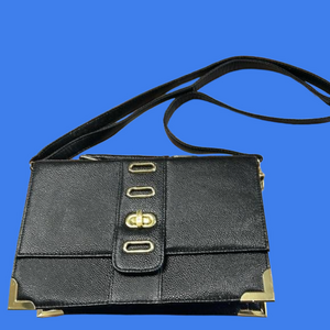 New (WOTs) Black patent leather purse by Poppie with stylish gold accents.